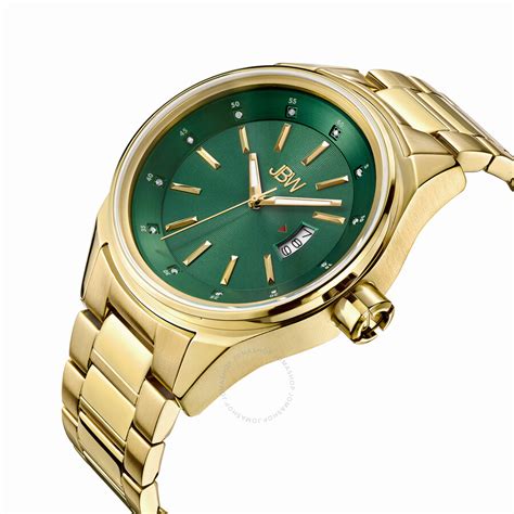 golden watch with green dial